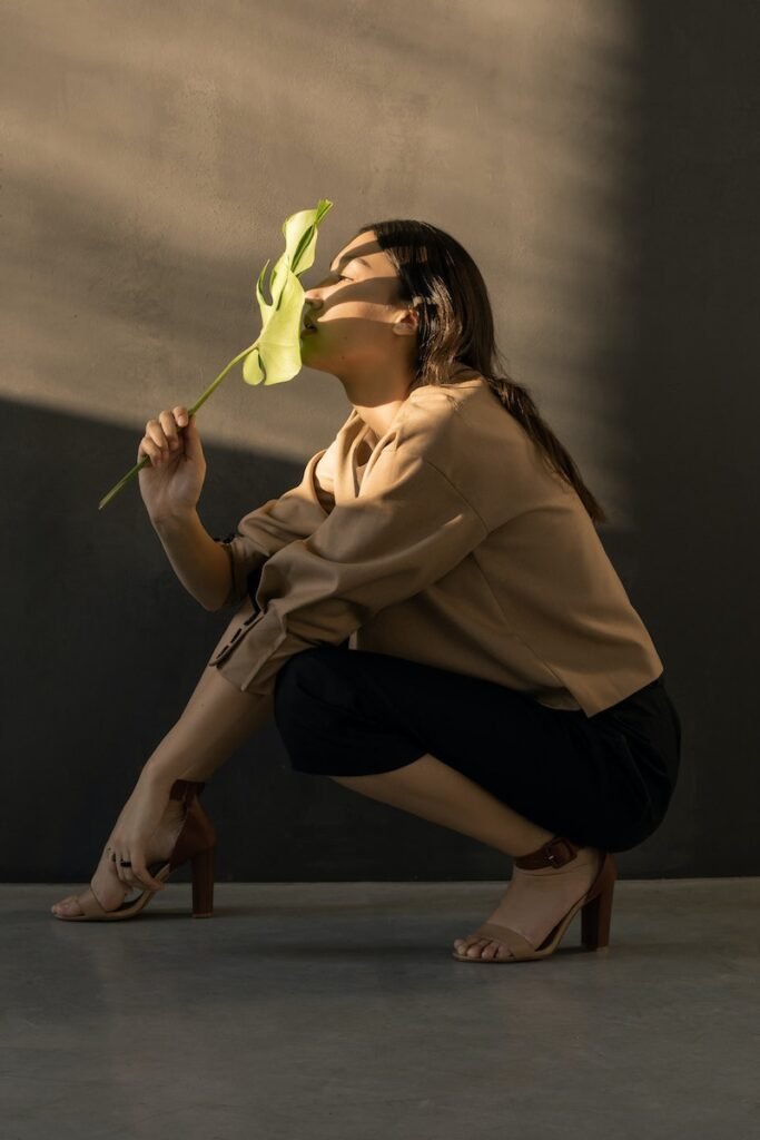 Woman Holding Green Leaf