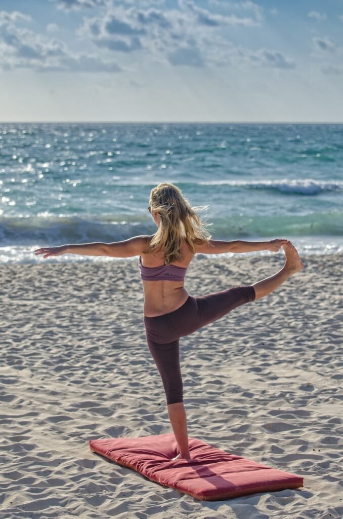 Woman Doing Yuga on Seashore