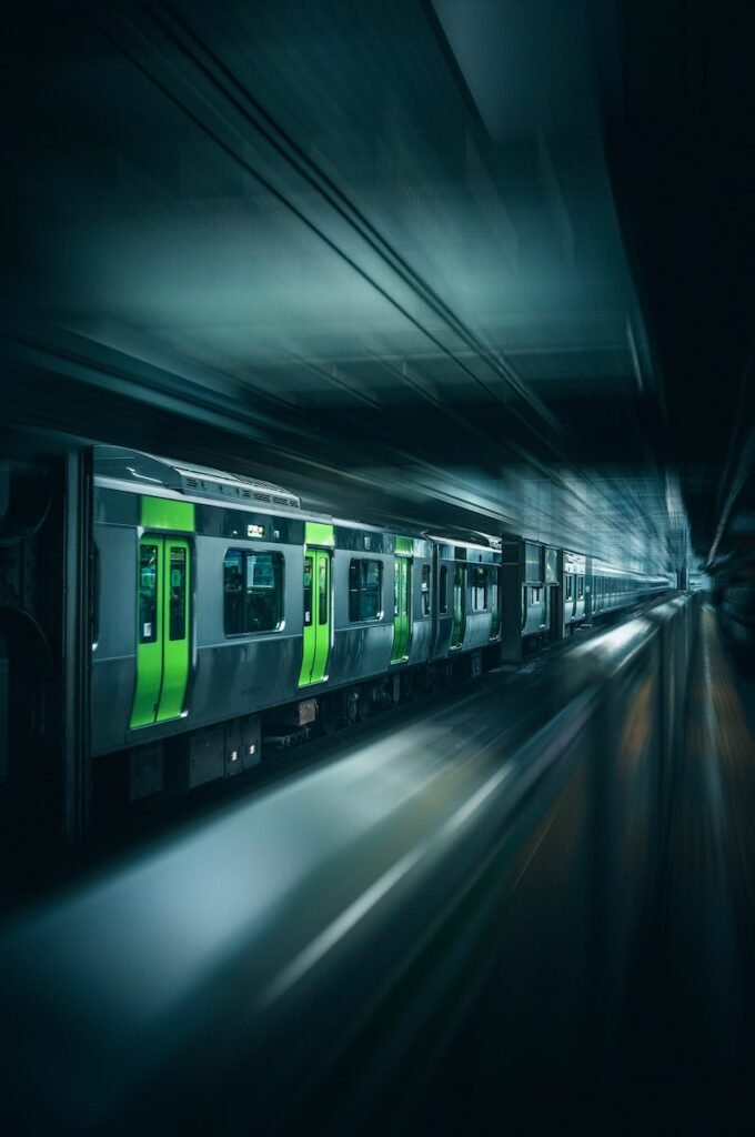 a subway train traveling through a subway station